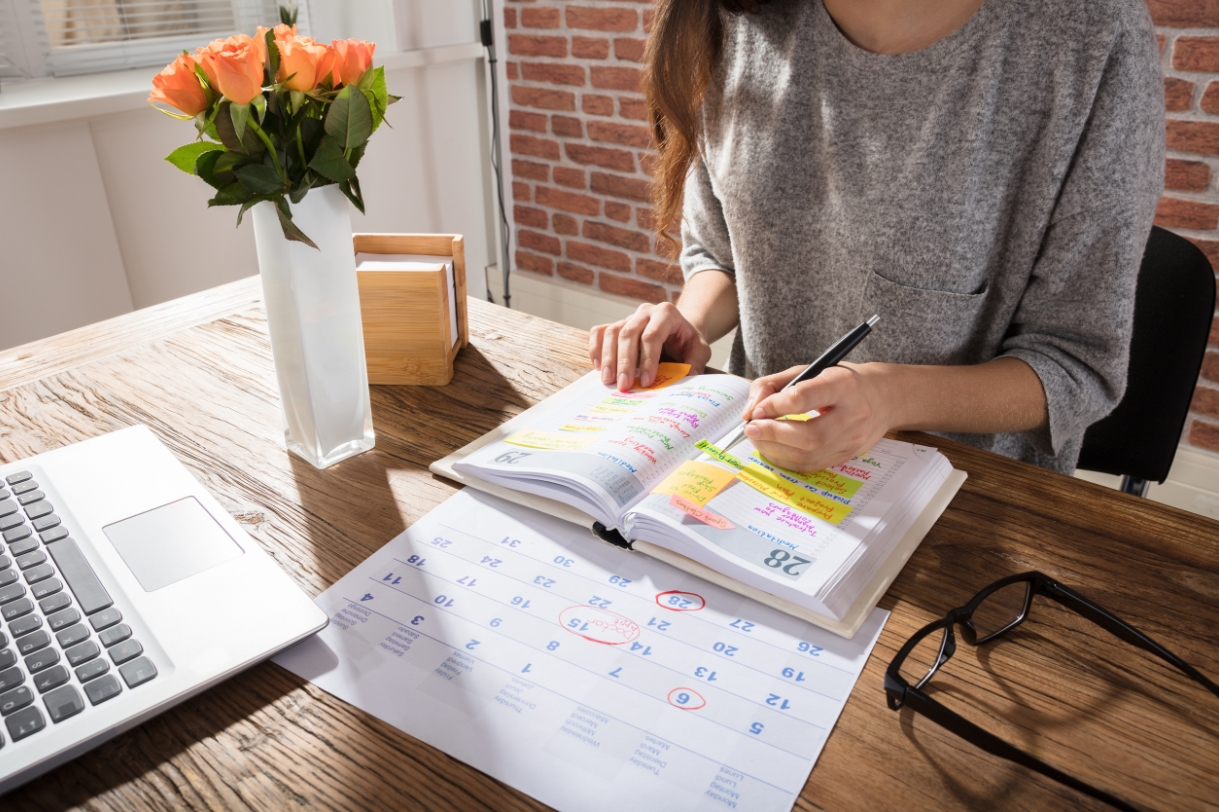 Student at a desk with calendar open